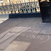 The graffiti on the pavement outside the Principal Hotel near York railway station in Station Road