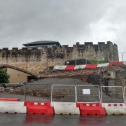 A section of the Queen Street Bridge has been left in place to support the ancient city walls until a new retaining wall can be built