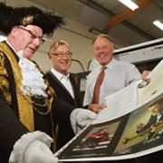 Lord Mayor Coun David Horton, Tony Reeves, who designed the layout, and John Richardson, managing director of printers Wood and Richardson, examine the programme for the John Barry tribute concert at the Barbican Centre