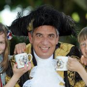 Wigginton School pupils Imogen Bell and Joseph Olney with the Lord Mayor of York, Coun Keith Hyman, after receiving their Jubilee mugs