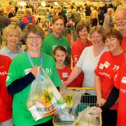 Louise Stock, of Tang Hall, fourth from right, was given a helping hand by Lady Jane Gibson, the wife of Morrisons chairman Sir Ian Gibson, when she visited the Morrisons store in Foss Islands Road, York on Saturday.
