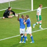 Mario Balotelli (second left) celebrates Italy's second goal