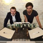 Actors Ferdinand Kingsley, right, and Graeme Hawley, take a look at the model of the performance area