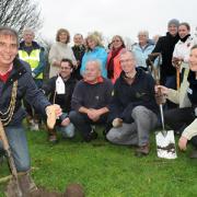 The Lord Mayor of York, Keith Hyman, plants the sapling at Willow Bank in New Earswick, as part of a scheme in which volunteers, some of whom are pictured, planted 420 trees