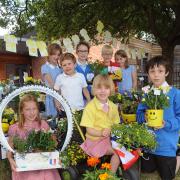 Pupils from Dunnington School with some of the Drand de Part floral display the school has created and which can be seen at the front of the school. Picture David Harrison. (7810628)