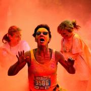 IN THE RED: Competitors in action in the Run or Dye event at Castle Howard