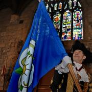 Cllr Brian Watson, with the Yorkshire flag in the Guildhall, during his term as Lord Mayor