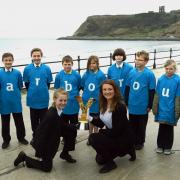 The Tour de Yorkshire trophy visits Scarborough, with children from Scalby and Friarage schools, and Emma Towning from North Yorkshire County Council