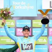 Team Sky's Lars Petter Nordhaug celebrates with the trophy after winning the inaugural Tour de Yorkshire