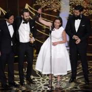 Shan Christopher Ogilvie, from left, Benjamin Cleary, Serena Armitage, and Michael Paleodimos accept the award for best live action short film for Stutterer at the Oscars at the Dolby Theatre in Los Angeles. Picture: Chris Pizzello
