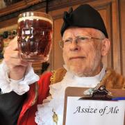 The Sheriff of York Jonathan Tyler scrutinises a pint, as he prepares for the Assize of Ale