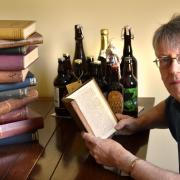 David Smith with some of his beer history books and special bottles