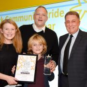 Flashback: Ian Donaghy, supported by his children Annie and Bill, receives his York Community Pride award from Peter Robinson, of sponsors Benenden