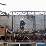 A firefighter surveys the damage caused by the blaze at York High School