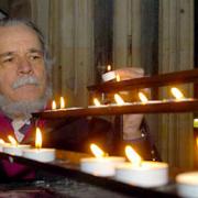 John Bibby, currently on hunger strike in York Minster, lights a candle