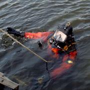A police frogman searches the canal at Burn Bridge. Pictures: Eric Foster