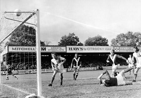 12/10/74 - York City 3, Bristol Rovers 0: A fine save by Bristol Rovers keeper Jim Eadie, who just managed to tip this shot from Dennis Wann over the bar.