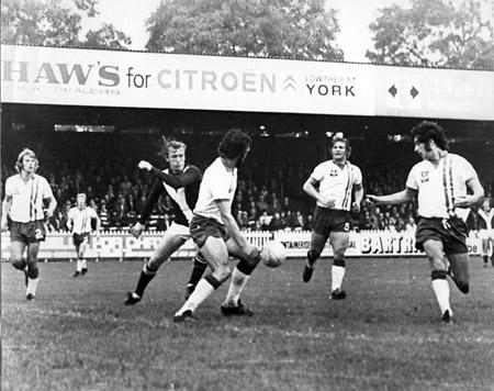 28/09/74 - York City 3, Portsmouth 0: City's bustling Jimmy Seal shows determination despite being outnumbered four to one by Portsmouth defenders.