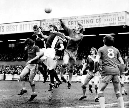 13/04/74 - York City 0, Shrewsbury 1: The Shrewsbury 'keeper gets up to punch the ball clear from York City's Swallow (centre) and Topping.