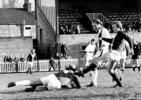 07/02/76 - York City 2, Luton Town 3: Horne, the Luton goalkeeper dives at the feet of Jimmy Seal, just beating the City forward to the ball.