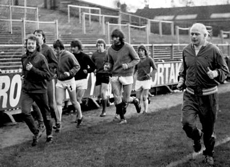 17/02/75: There were no Monday morning blues for Yotk City's new manager, Wilf McGuinness. He was in early at Bootham Crescent jogging around the tack with the City players.