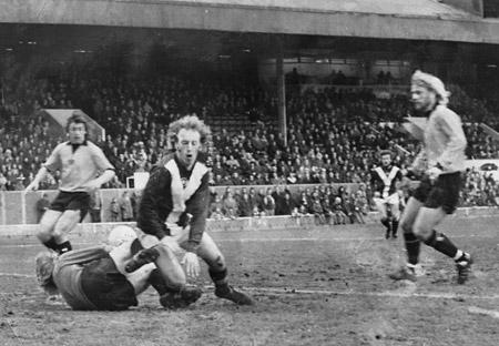01/04/75 - York City 0, Blackpool 0: A near miss by City as Ian Holmes is just beaten to the ball by Jeff Wealands after Chris Jones had headed an Ian Butler cross in the goalmouth.