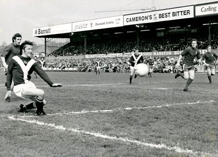26/04/75 - York City 0, Oldham Athletic 0: In City's last match of the season, Barry Lyons cracks in a shot from the edge of the goal area which brought a fine save from Oldham 'keeper Chris Ogden.