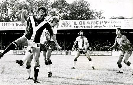 28/09/74 - York City 3, Portsmouth 0: Striker Jim Hinch (No. 10) gets up high in a tussle for the ball at Bootham Crescent.