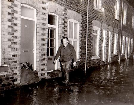 A resident of Lower Ebor Street, York on flood patrol in 1982