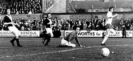 28/02/75 - York City 2, Southampton 1: Southampton's Mike Channon leaves York City 'keeper Crawford looking on in vain as he slices the ball past him to score the visitor's goal.