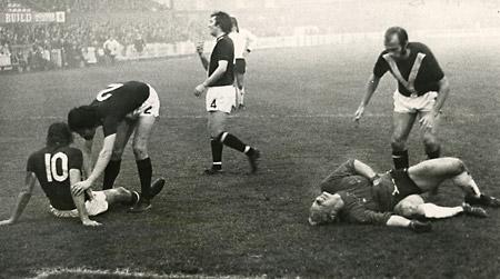 15/11/75 - York City 1, Fulham 0: Chris Jones (10) goes down after a rugby tackle by Fulham goalkeeper Peter Mellor, who was injured in the process. Peter Creamer (2) goes to the aid of his colleague while Derrick Downing goes to the aid of Mellor.