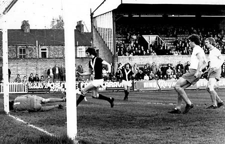 19/04/76 - York City 1, Blackpool 1: Blackpool goalkeeper George Wood saves from Ian Holmes at the foot of the post with Jimmy Hinch racing in.