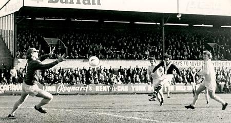 20/03/76 - York City 3, Nottingham Forest 2: Eric McMordie drives a hard shot past Forest 'keeper Wells in the first minutes of the match, but City's hopes were dashed when the 'goal' was disallowed.