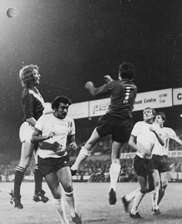 02/09/75 - York City 0, Liverpool 1 (League Cup): Ray Clemence, the Liverpool 'keeper, leaps high to punch clear a centre with Barry Swallow at full stretch.
