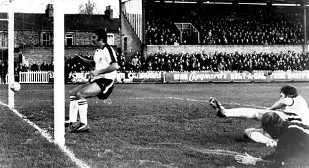 03/01/75 - York City 2, Hereford United 1: York City's second goal in the third round FA Cup tie at Bootham Crescent. Hereford defender John Cayton looks on in dismay as this shot from Bobby Hosker (not in picture) from a narrow angle goes into the net.