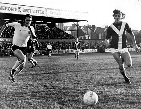 03/01/75 - York City 2, Hereford United 1 (FA Cup): Jimmy Hinch and Hereford defender Dave Rylands chase a loose ball after a pass back which eluded goalkeeper Tommy Hughes.