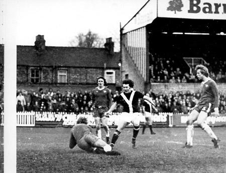 24/01/76 - York City 0, Chelsea 2 (FA Cup): Chelsea and former England goalkeeper Peter Bonetti dives to save a header from Jimmy Seal following a cross from Micky Cave, as Eric McMordie runs in during the second half of the Cup tie at Bootham Crescent.