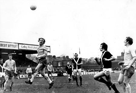 14/02/76 - York City 1, Carlisle United 2: A Carlisle defender heads the ball away as Woodward moves in.
