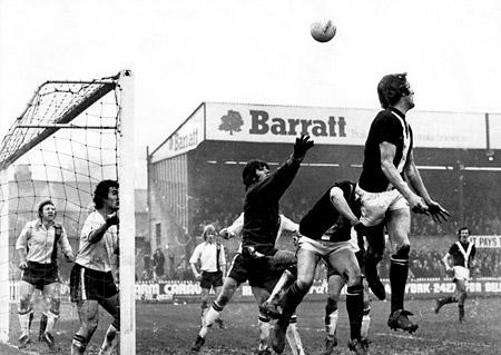 07/02/76 - York City 2, Luton Town 3: York City captain Barry Swallow heads on a corner kick with two Luton defenders covering their goal-line.