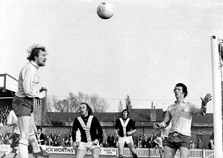 28/02/76 - York City 2, Southampton 1: Peach the Southampton full back heads the ball passed his own goal to conceded a corner while under City pressure from Holmes and Hinch