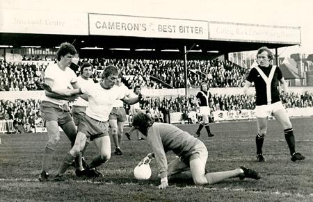 19/04/76 - York City 1, Blackpool 1: Three defenders and Jimmy Seal look on as Blackpool 'keeper George Wood drops on the ball during the game at Bootham Crescent.