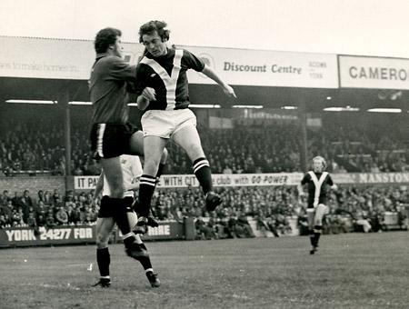 18/10/75 - York City 1, Bristol City 4: Bristol 'keeper Ray Cashley claims the ball in this mid-air clash with City's Eric McMordie.