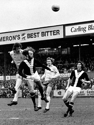 28/02/76 - York City 2, Southampton 1: Paul Gilchrist, the Southampton centre forward, gets in a flying header despite the attention of City defender Derrick Downing. Jim Hinch, scorer of the dramatic winning goal is on the right.