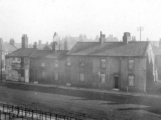 Numbers 1-4 Barbican Road, pictured from the Bar Walls in about 1910.
