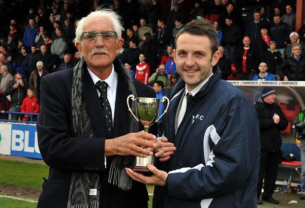 HAPPIER TIMES: Departing York City director Rob McGill presents former midfielder Scott Kerr with a trophy during the club's 2012 Wembley double-winning season