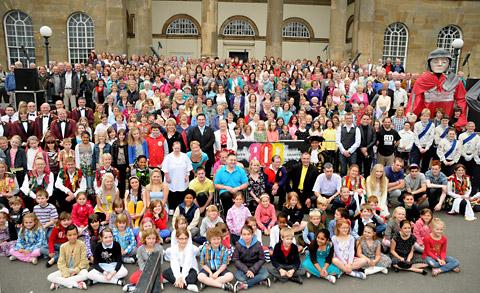 The massed choirs on the steps of the Castle Museum      