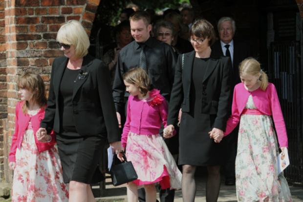 Steve Barber's long term partner Donna Rogers (left) and John Taylor's widow Karine Taylor leave St Everilda's Church, Nether Poppleton, after the joint memorial service.