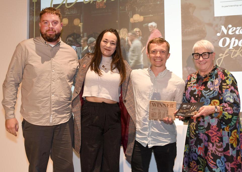 Prof Sarah Brown, governor of the Merchant Adventurers, right, presents New Opening of the Year Award to Black Wheat Club's Robin Mountford, Lydia Harrison and Billy Griffin. <i>(Image: The Press)</i>
