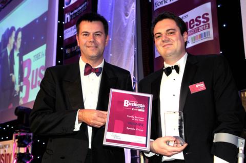 James Buffoni (right) of the Ryedale Group receives the Family Business of the Year award from Garbutt & Elliott's Craig Manson.