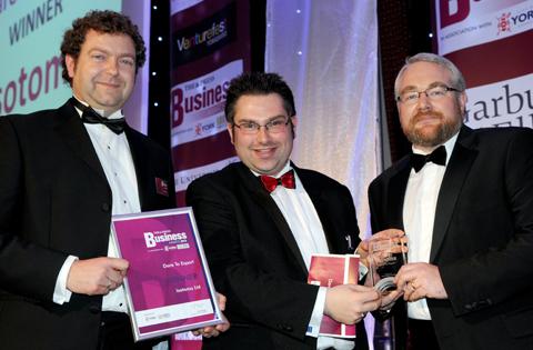 City of York Council leader James Alexander (centre) presents the Dare to Export award to Andy Theyers (left) and Doug Winter of Isotoma.